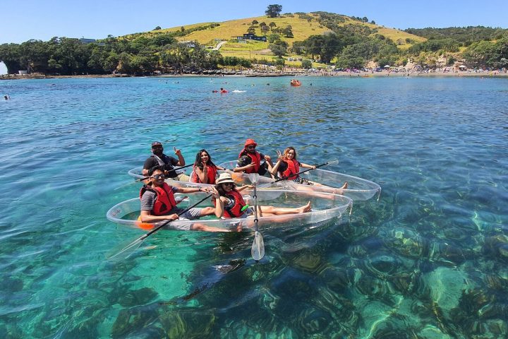 a group of people on a boat in the water